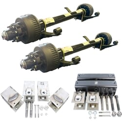 Two Dexter 12,000 lbs. electric brake trailer axles with a 74" track and 46" spring centers, hangers, equalizers, u-bolts, hangers, and springs without wheels and tires.